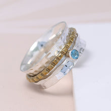 Load image into Gallery viewer, Sterling silver spinning ring with Blue Topaz gemstone