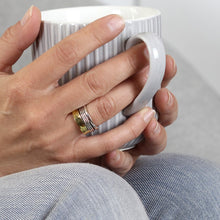 Load image into Gallery viewer, Sterling silver spinning ring with brass hammered edge