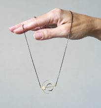 Load image into Gallery viewer, Brass rings within rings necklace