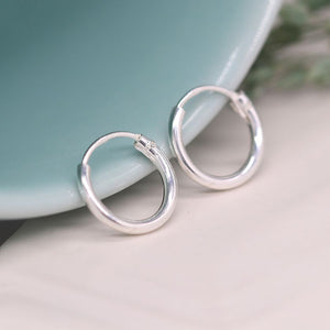 Tiny sterling silver creole earrings