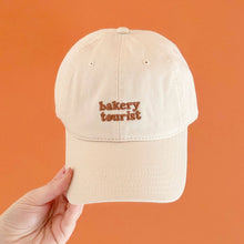 Load image into Gallery viewer, Bakery Tourist - Cotton Baseball Cap - Vanilla
