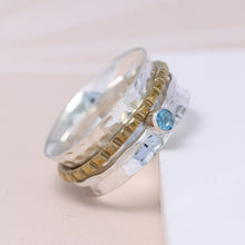 Load image into Gallery viewer, Sterling silver spinning ring with Blue Topaz gemstone
