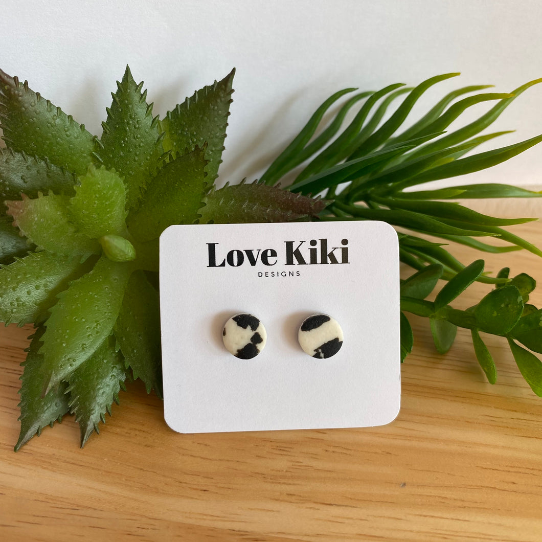 Small round black and white clay stud earrings
