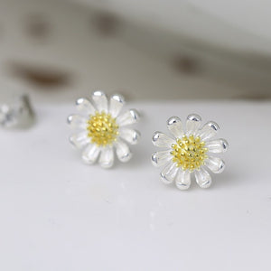 Silver daisy stud earrings with gold plated centres