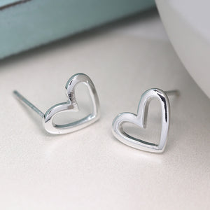 Smooth silver heart cut out studs