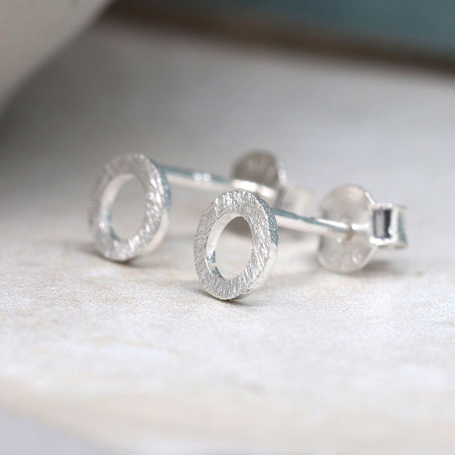 Tiny brushed silver circle studs