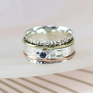 Sterling silver floral spinning ring with Iolite