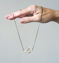 Load image into Gallery viewer, Brass rings within rings necklace
