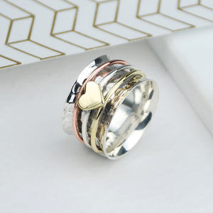 Sterling silver spinning ring with mixed metals and heart
