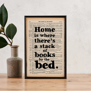 Home is where there's a stack of books by the bed - book page print