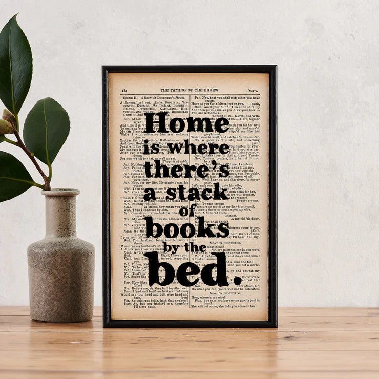 Home is where there's a stack of books by the bed - book page print