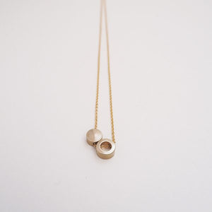 Brass ring and disc necklace