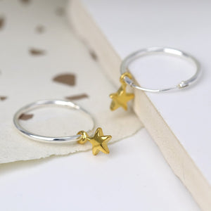 Silver hoop and gold star earrings